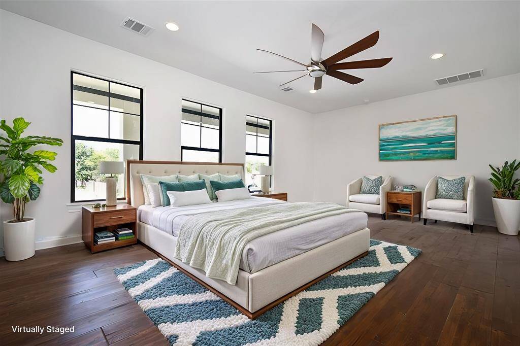 Virtually staged - The spacious primary bedroom is located downstairs, and features a fabulous en-suite bath and dream closet.
