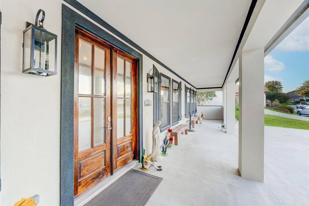 The front porch spans the width of the entry