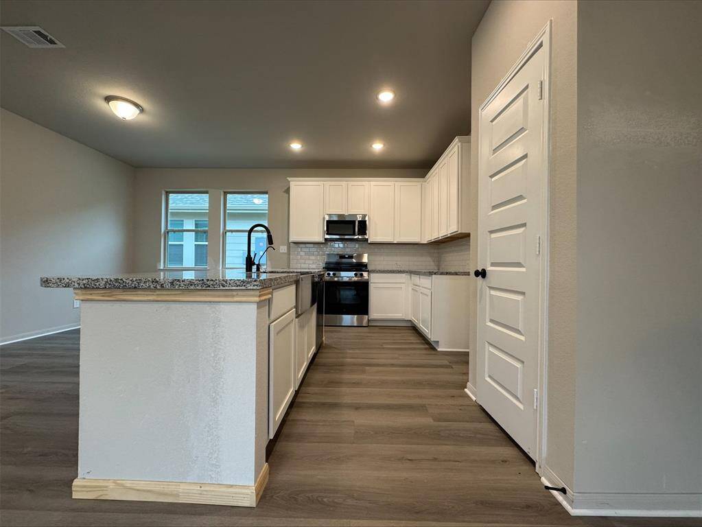 Island kitchen with granite countertops