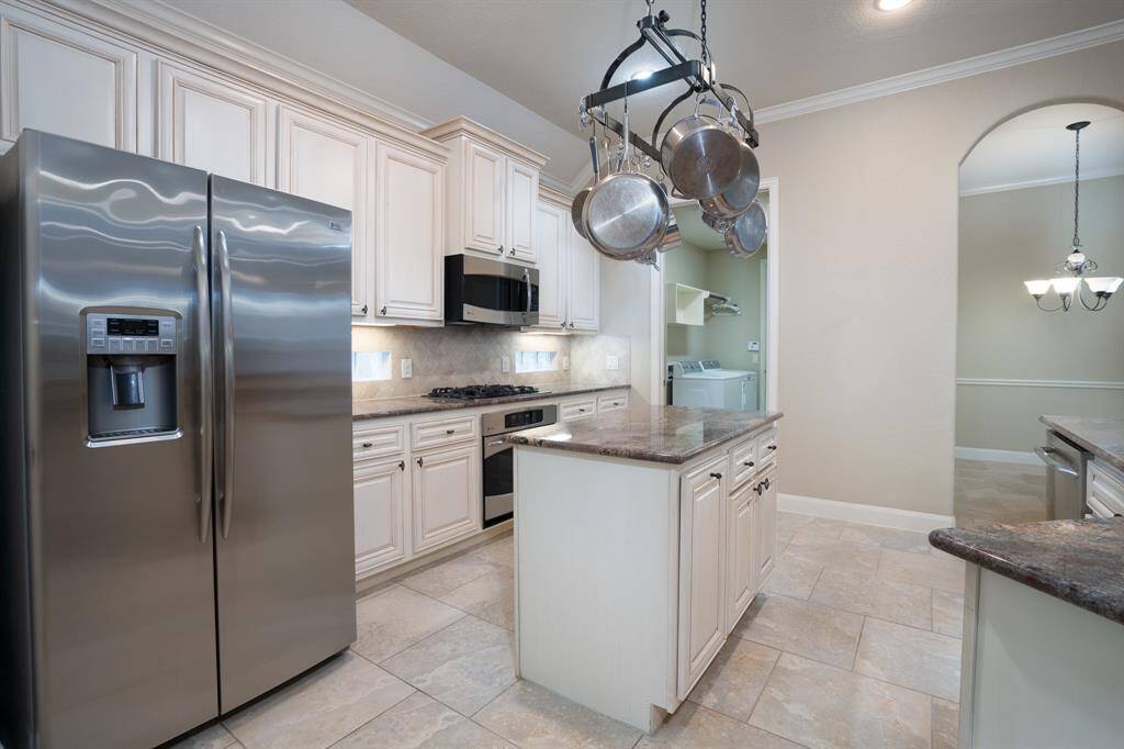 Current view of kitchen. Fridge can stay. Also a fridge in garage that can stay.