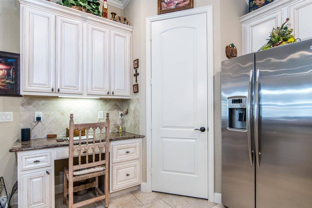 Current view of laundry room. Washer/dryer and furniture storage piece can stay.