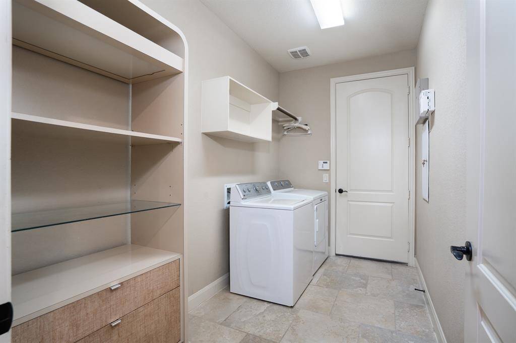 Current view of home office with wood flooring has a closet and can also be used as a bedroom.