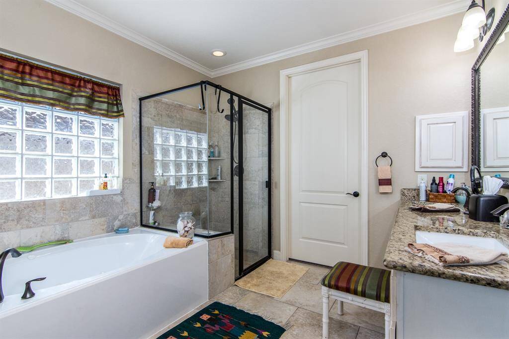 There is a large walk in closet and dual vanities.