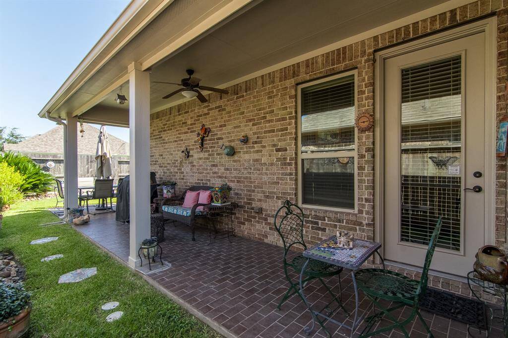 Patio table and chairs along with umbrella can stay.