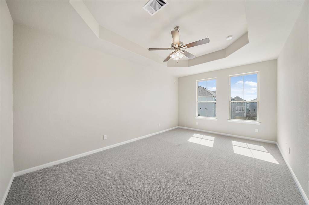 Relaxing owner's suite with tray ceiling
