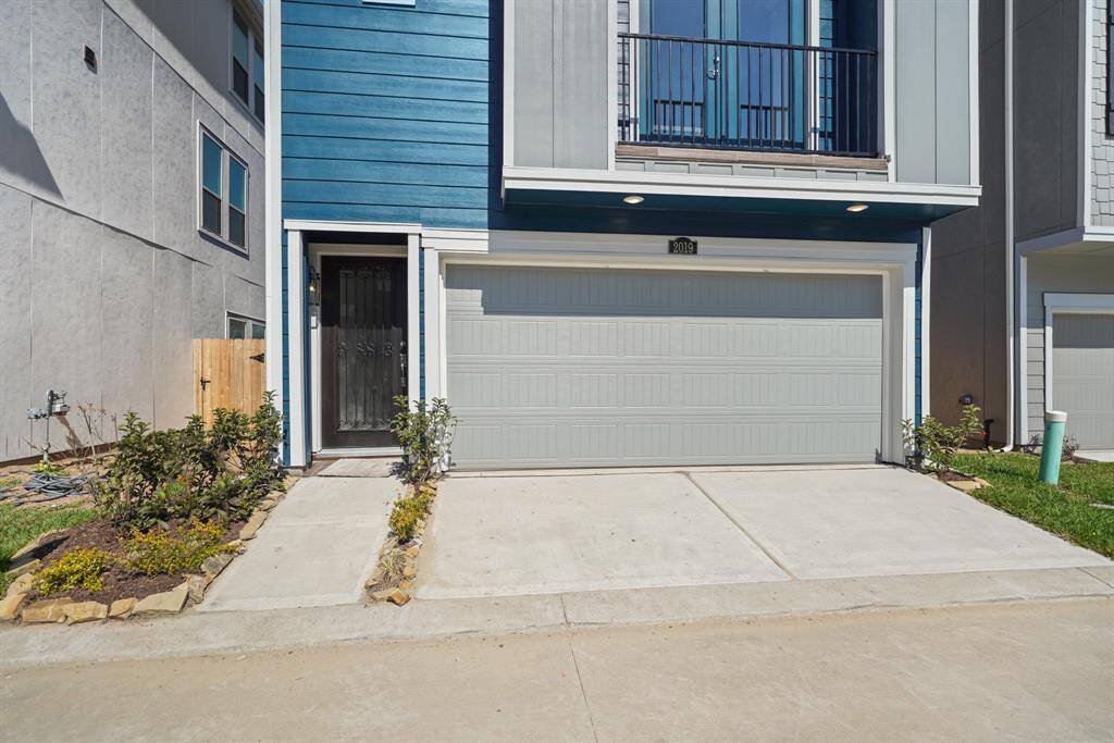 Three-story home with 3 bedrooms, 3.5 baths and 2 car garage