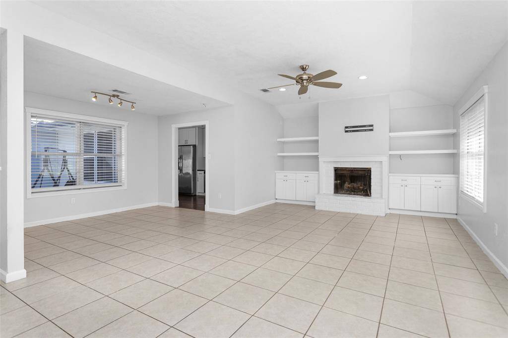 Living room boasts a cozy fire place with built ins that add plenty of character.