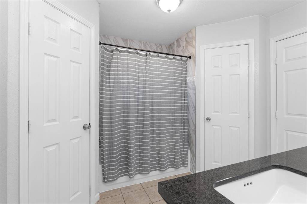 Primary bathroom with 2 sinks and 2 closets.
