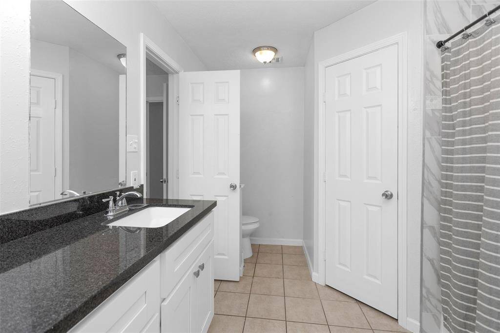 Primary bathroom with 2 sinks and 2 closets.