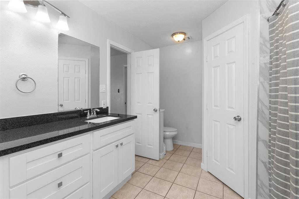 Primary bathroom with 2 sinks and 2 closets.