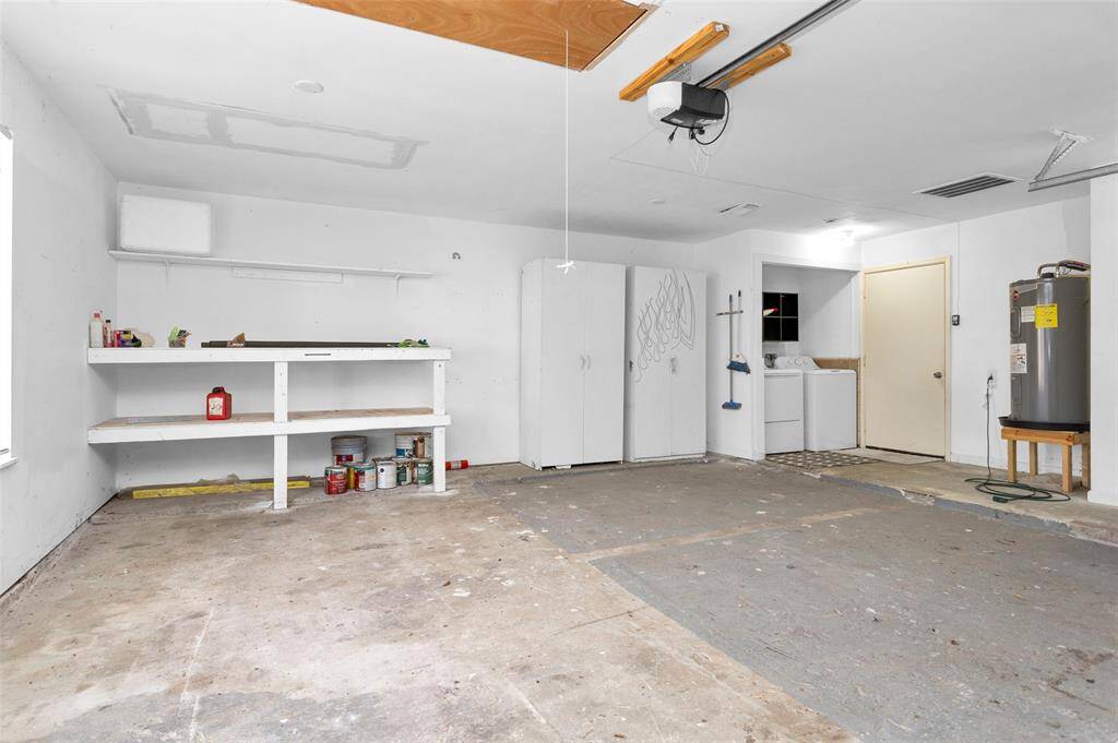 Garage with storage shelves.