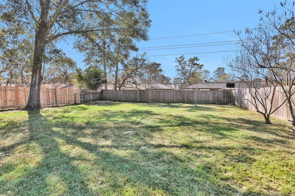 Beautiful large backyard with covered patio.