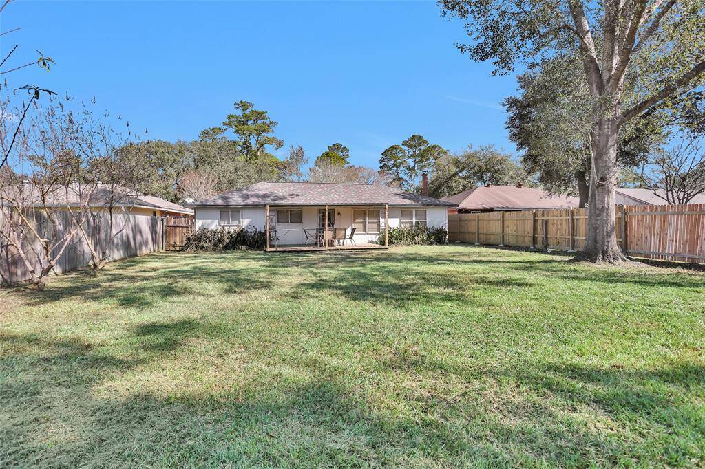 Beautiful large backyard with covered patio.