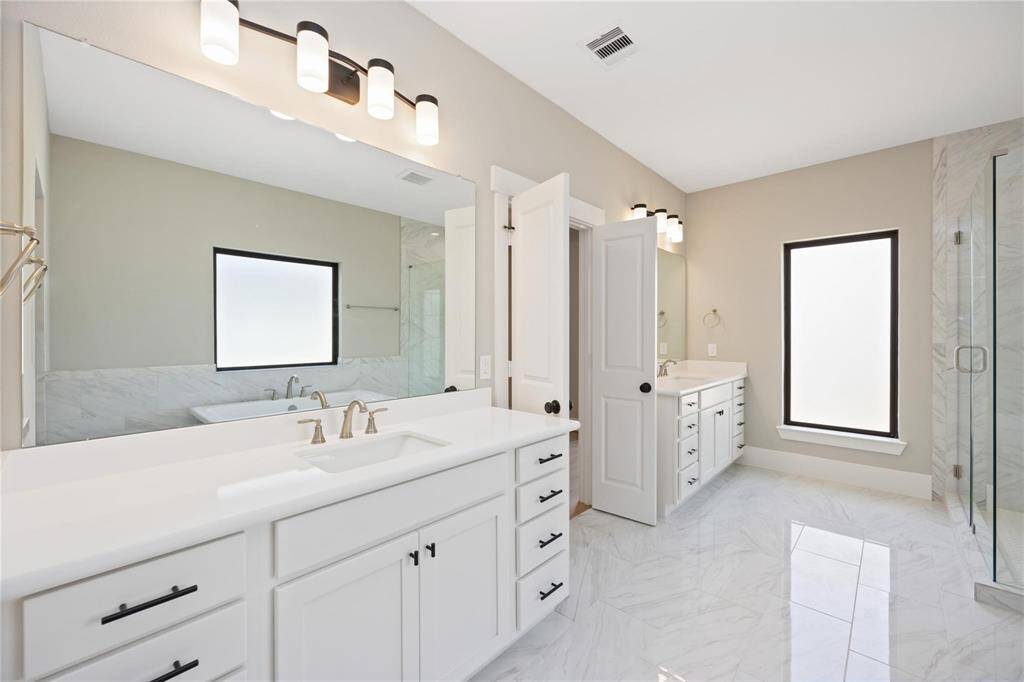 This is a representative photo of the spacious primary bath with separate sink space