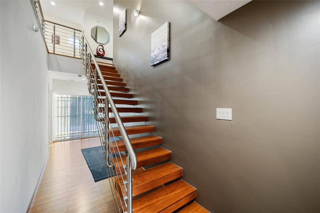 Floating Staircase with contemporary polished metal design finish.