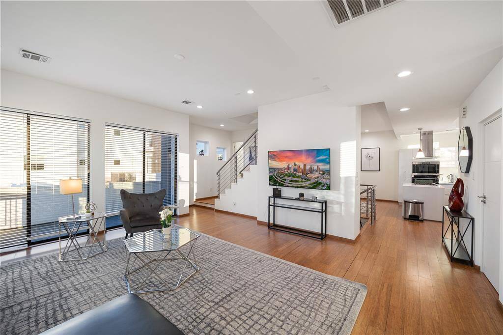 Living room with access to one of the many balconies.