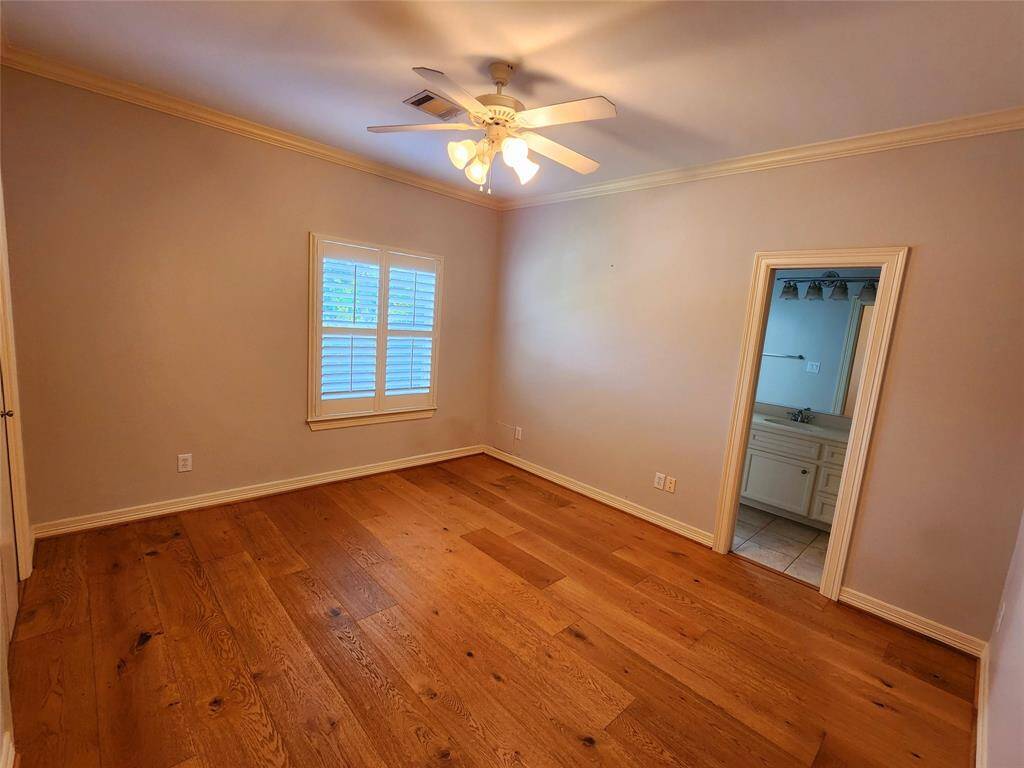 Secondary bedroom upstairs. Check out those French Oak Hardwood Floors!