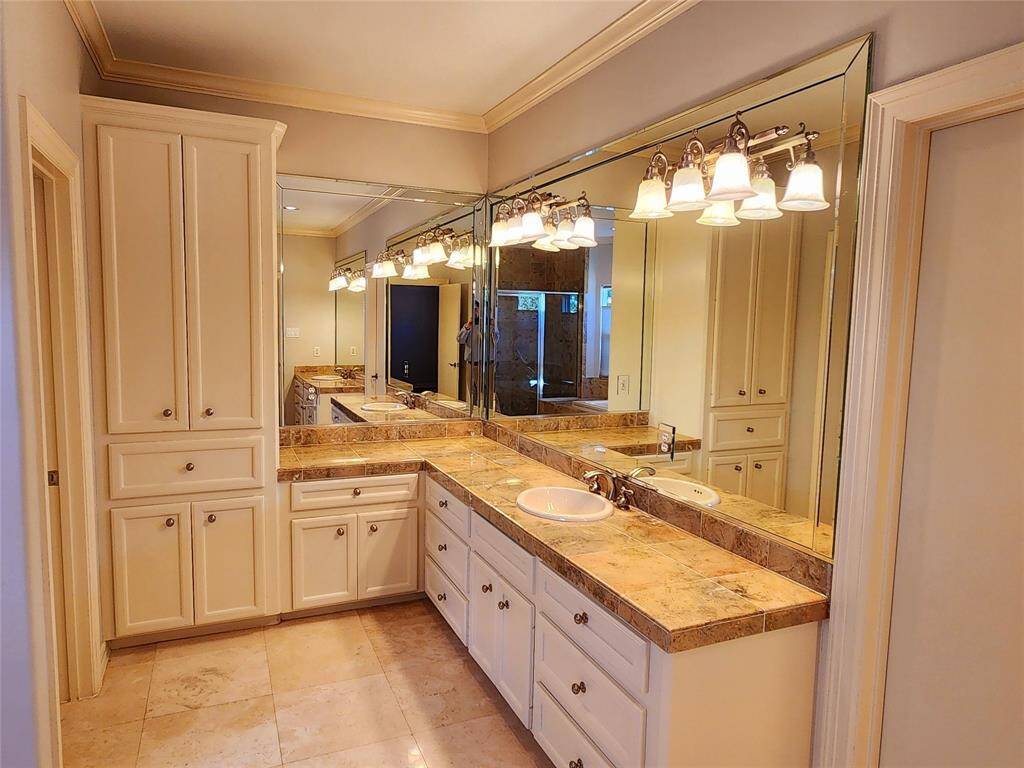 Countertops for miles and lots of cabinets.
