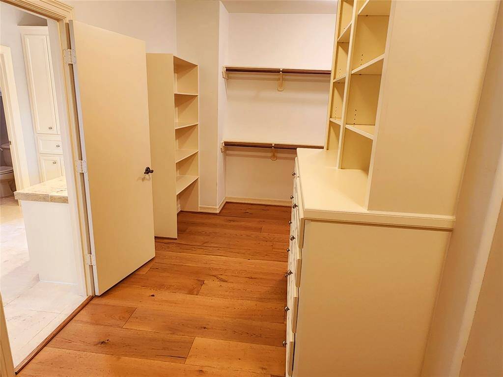The primary closet has two sides and it is massive in size.