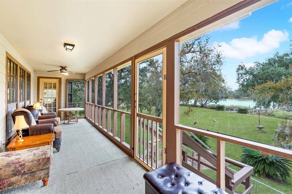 The screened in balcony is the perfect place to relax with your morning cup of coffee. Look at that view!