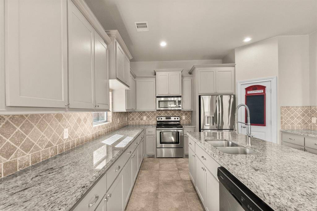 Kitchen with included double size refrigerator and walk in pantry
