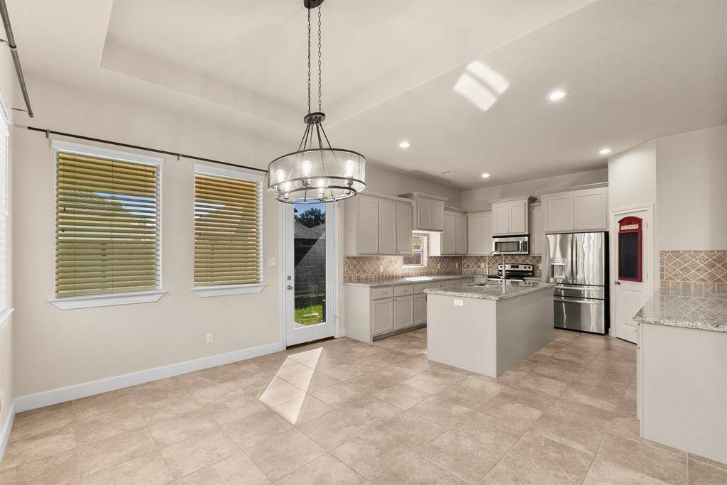 Dining area with easy access to kitchen and patio