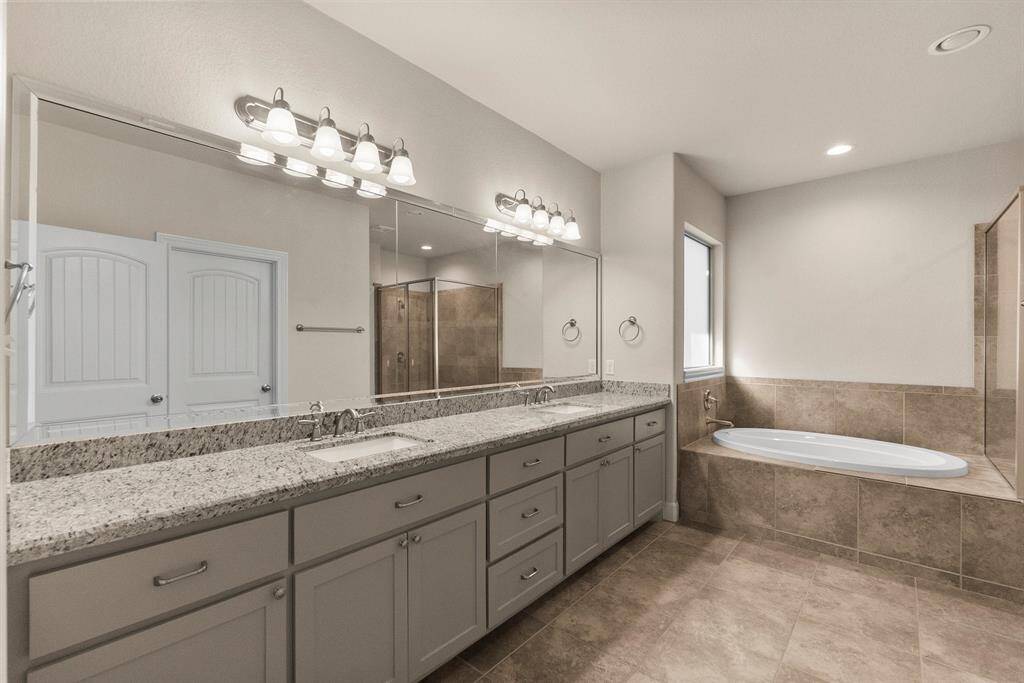 Double sink vanity and abundant storage in primary bath