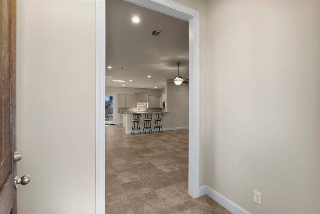 Entrance through front door into meticulously maintained home