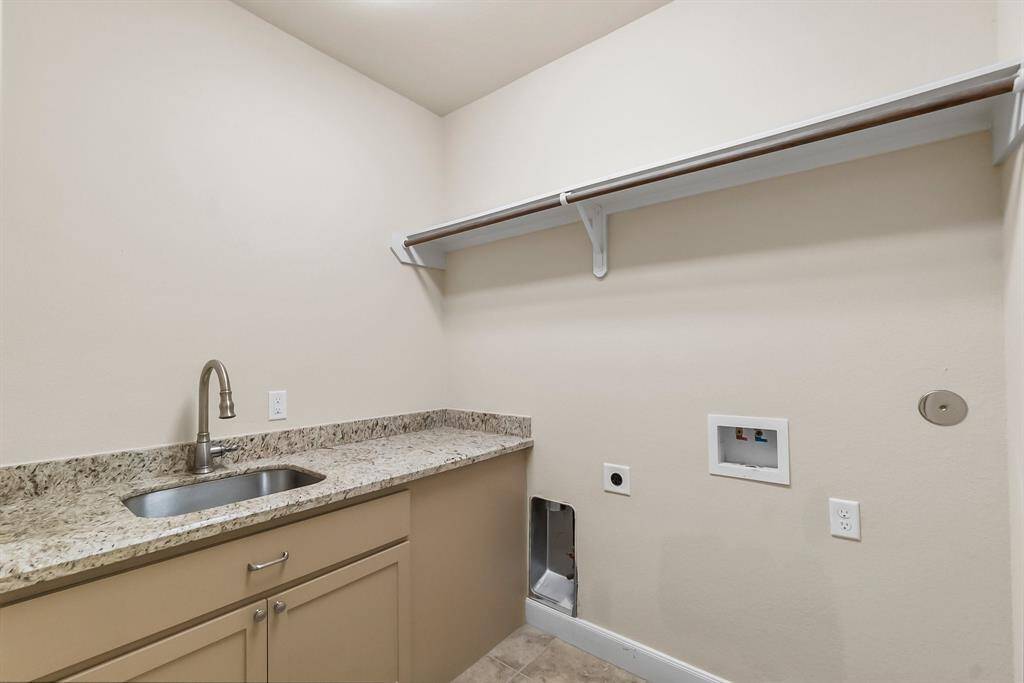 In house utility with sink and cabinets