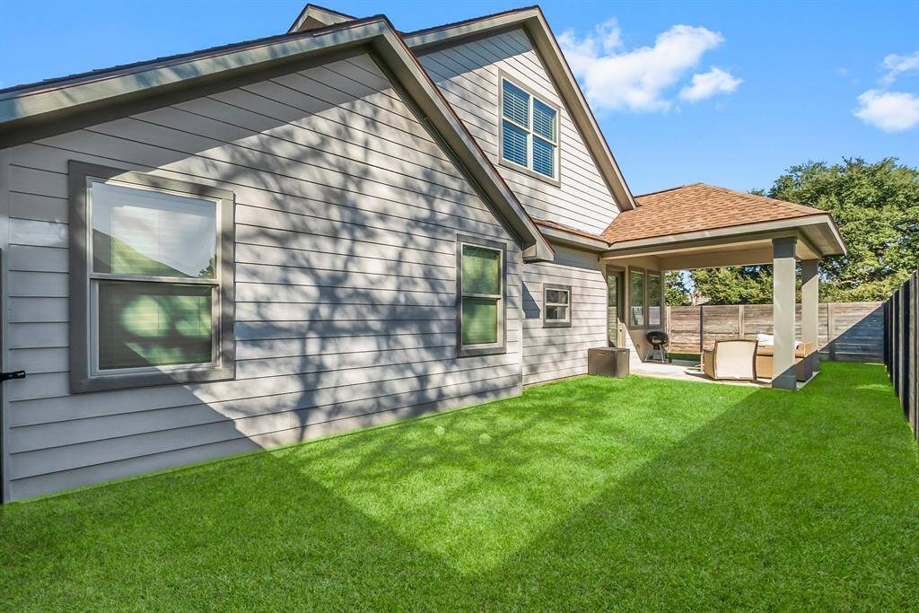 Back of home with patio