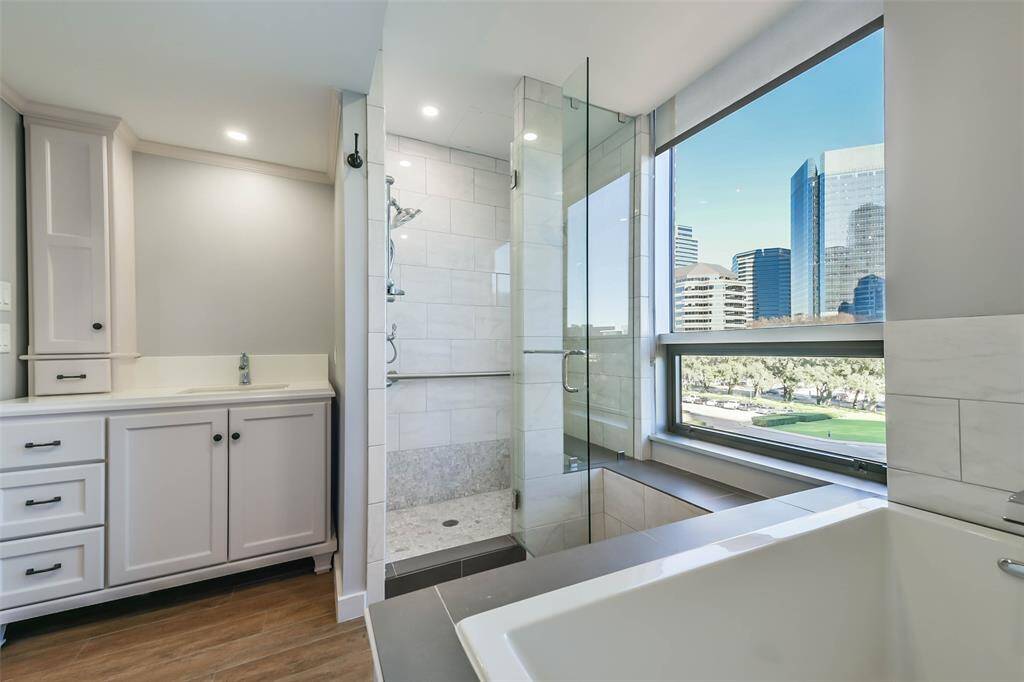 The primary bathroom prioritizes comfort and luxury with high-quality fixtures and finishes.