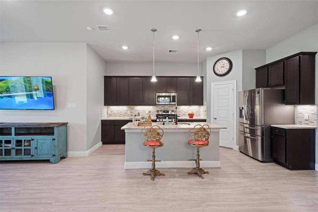 With granite countertops, under cabinet lighting, and stainless steel appliances what more could you ask for?