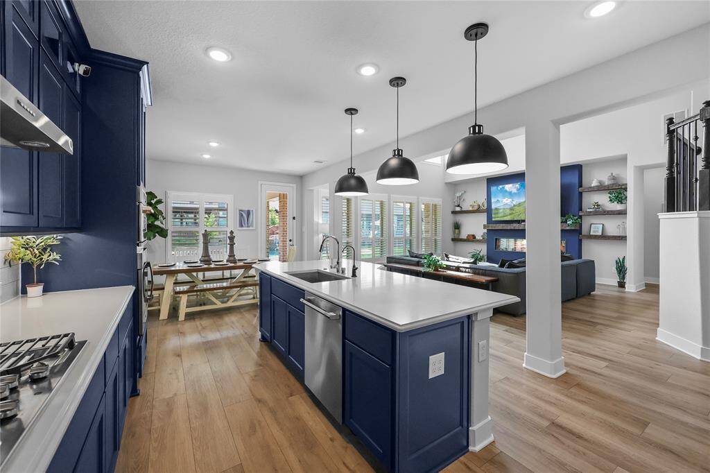 Did you catch how open the kitchen is to the main living spaces? Plus it has a great view of your future pool!