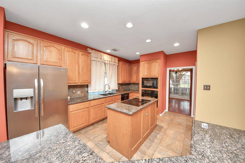 The storage in this kitchen offers room to keep the counters clear.