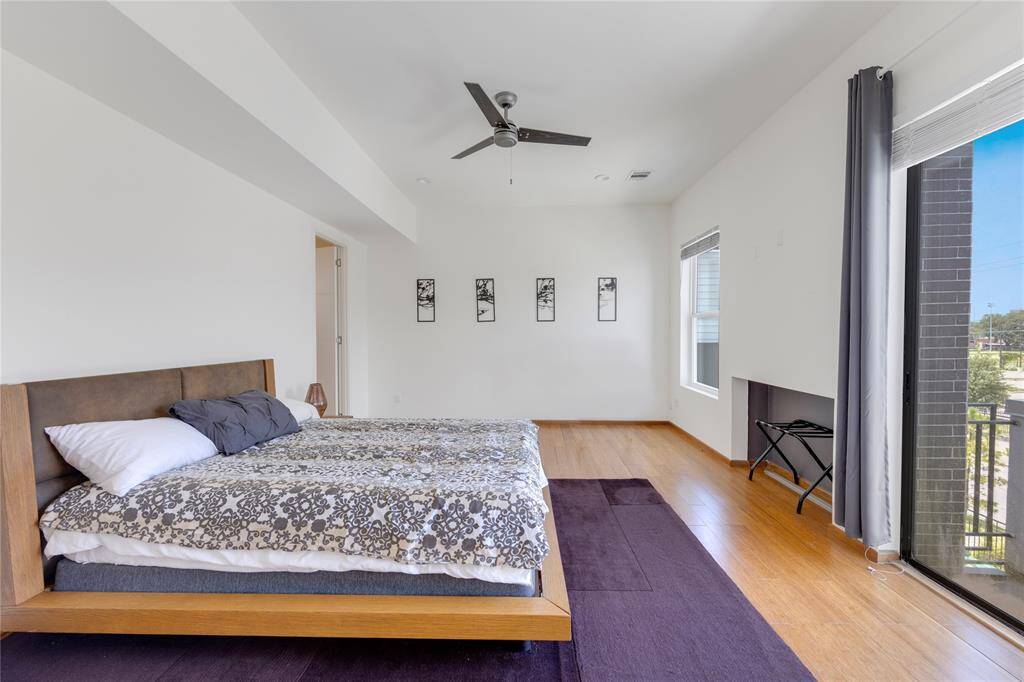 Primary bedroom with plenty of space and natural light.