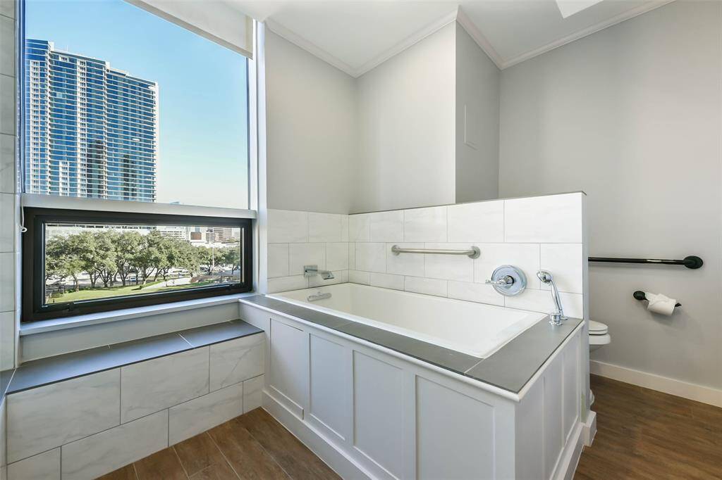 Relax and enjoy the views from the soaking tub in the primary bathroom.