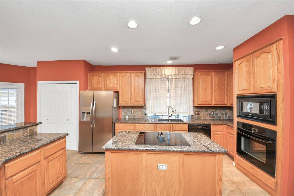 The pop-out window by the sink gives way to a large view and once again, allows for natural light to come in and brighten your day.