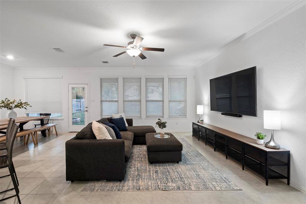 Modern open-plan kitchen living room allows natural light and enhances a bright airy atmosphere.