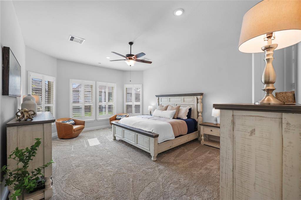 The primary bedroom is an impressive 20 X 15 feet. It has high ceilings, large bay windows with plantation shutters, and excellent natural light!