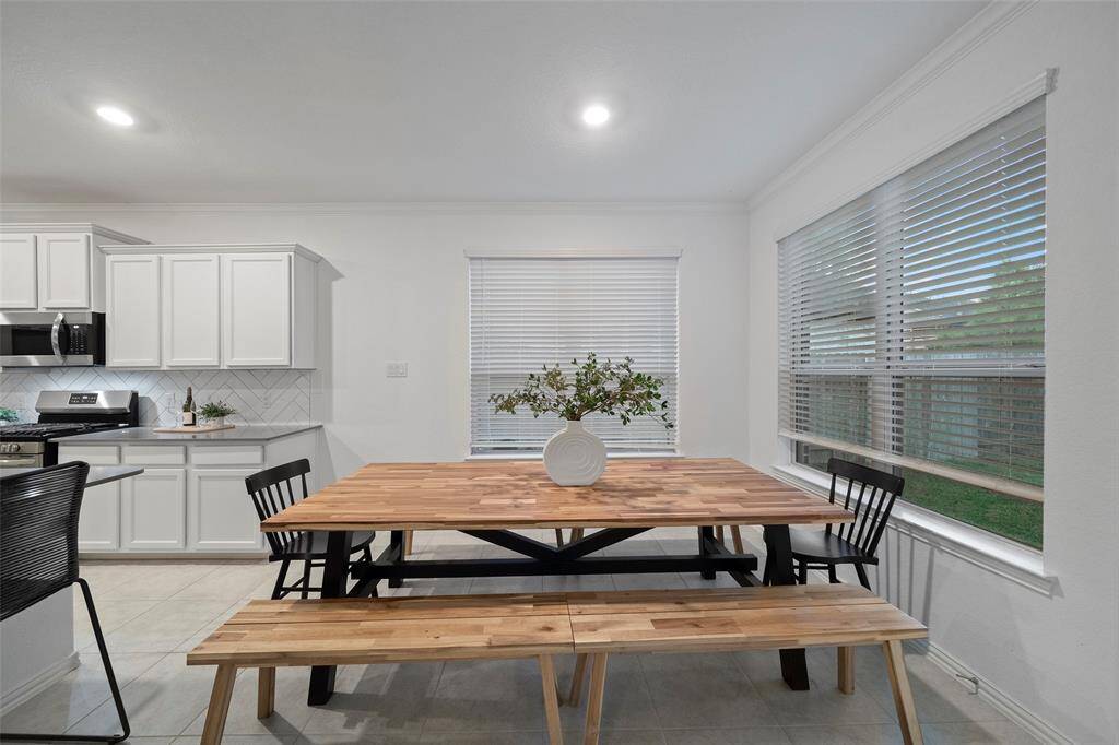 Elegantly situated just off the kitchen, this dining area provides a seamless flow for entertaining and daily meals!