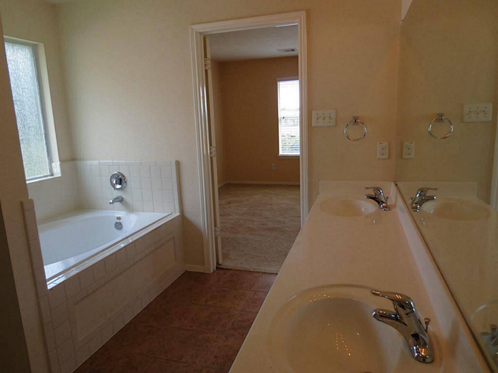 Master bathroom showing separate tub