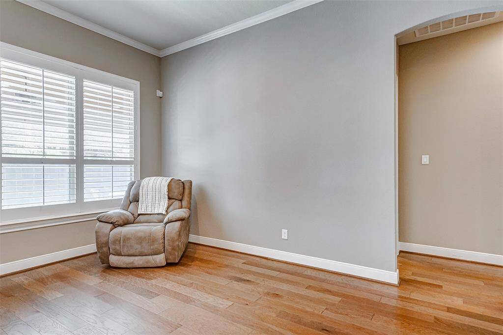 The breakfast room is open to the living area and back patio.