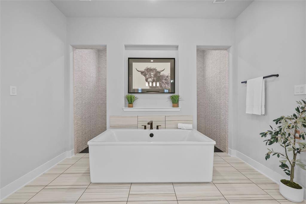 You'll love winding down after a long day thanks to the decadent freestanding tub. Picture lots of bubble baths & champagne drinking in this space!