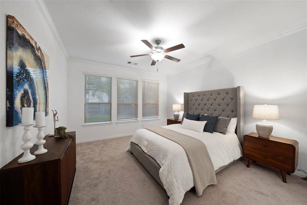 This light and spacious primary suite is a tranquil retreat.