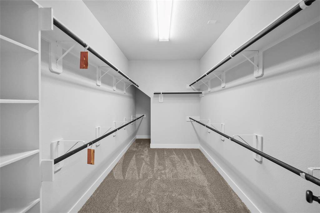 The primary closet is a site for sore eyes. Offering bountiful room for all your storage needs you can breath a sigh of relief.