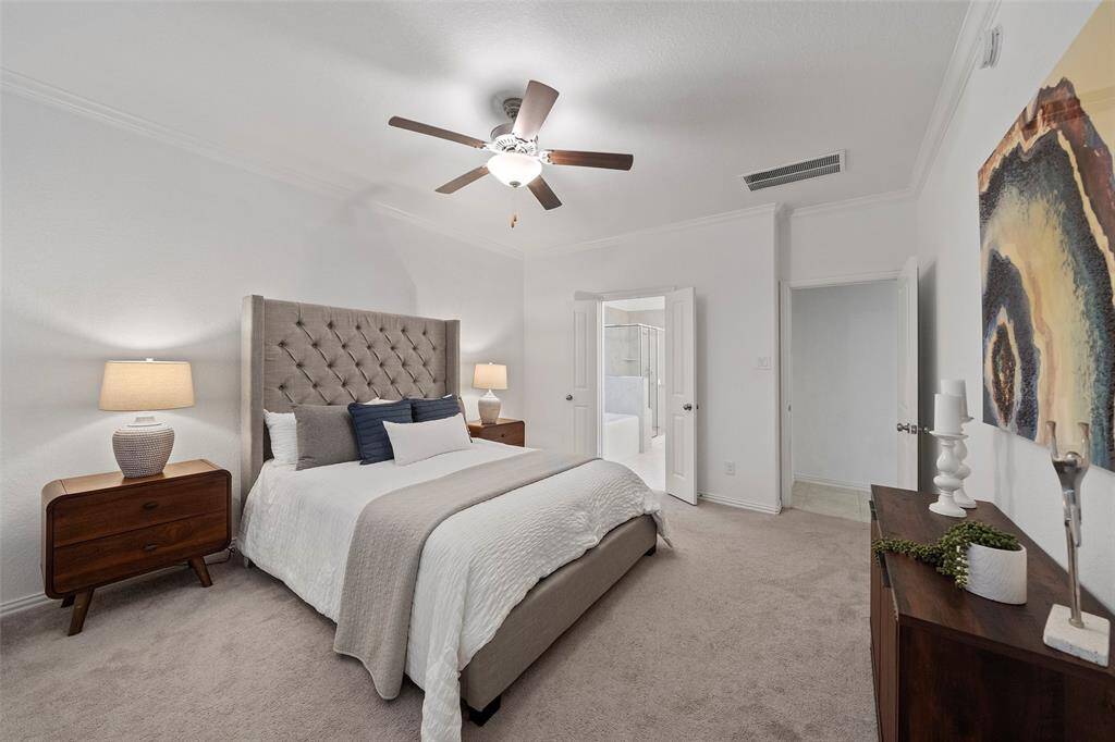 The primary suite offers a luxurious, spacious layout with a private en-suite bathroom and a large walk-in closet.