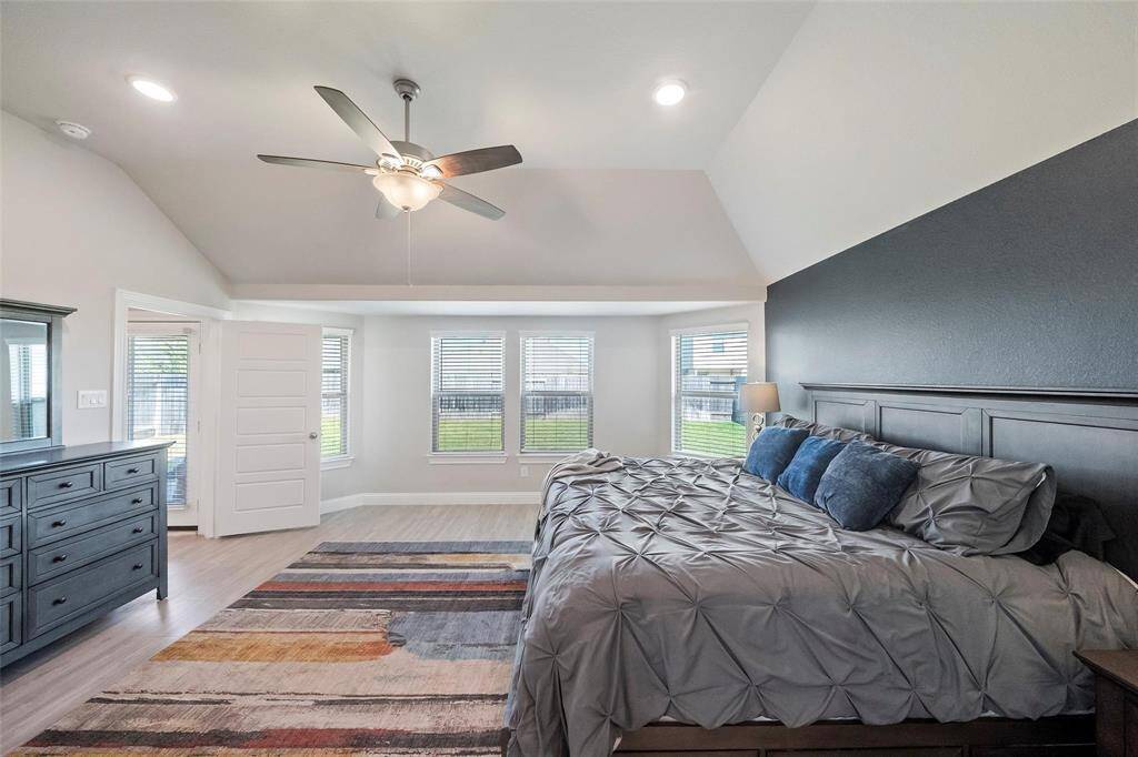 Plenty of space in the master suite and a view of the backyard.