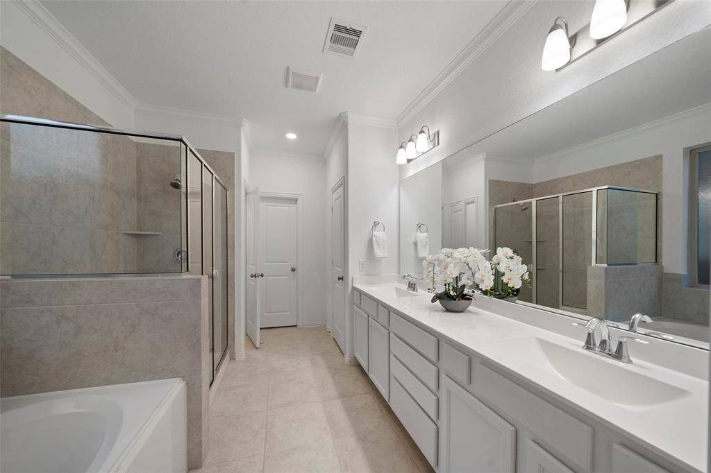 Primary Suite with dual sinks and quartz counters!
