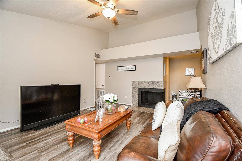 High ceiling, wood style flooring, double sided fireplace awaits you!