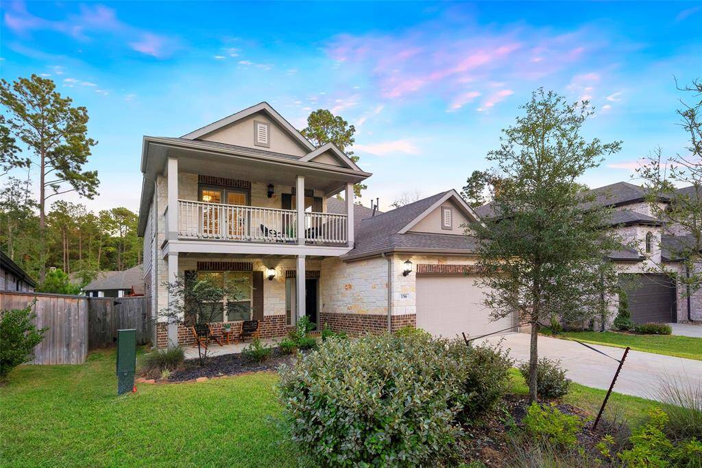 Welcome to your New Home- 156 E Cascade Hts Dr, Montgomery, TX 77316! Welcoming front porch and convenient attached garage!